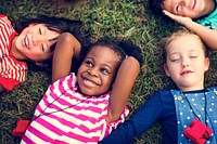 Diversity Group Of Kids Lying on Grass