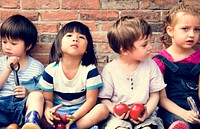 Group of Diverse Kids Sitting with Fresh Vegetable Together
