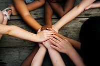 Group of children holding hand assemble togetherness