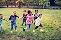 Happiness group of cute and adorable children playing in the par