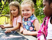 Group of Diverse Kids Drawing on Chalkboard Together