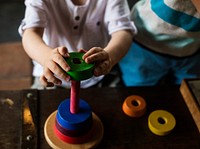 Wooden toy and child playing