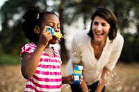 African descent girl is playing bubbles