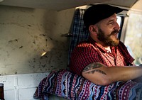 Man Sitting in  a Van Happiness With Friends