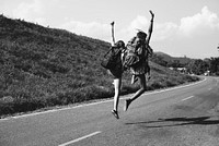 Diverse Backpacker Women Jumping on The Street