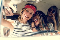 Girl friends taking a selfie on a road trip