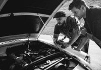 Men Checking Broke Down Car on Street Side with Open Hood