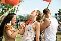 Group of Friends Drinking Beers Enjoying Music Festival Together