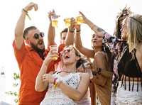 Group of Friends Drinking Beers Enjoying Music Festival Together