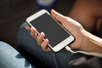 Close up of hands charging mobile phone