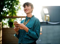 Businesswoman standing and using mobile phone