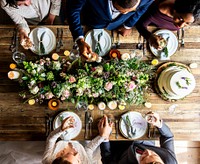 People doing a toast at a table