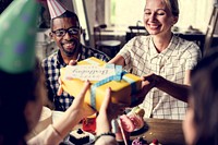 People celebrate birthday party with cake and gift