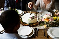 Bride and Groom Cutting Cake on Wedding Reception