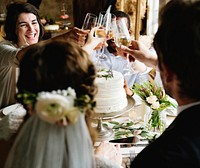 Bride and Groom Toasting with Wine Glasses at a Wedding Reception