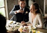 The groom feeding cake to the bride