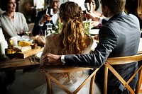 Bride and Groom Having Meal with Friends at a Wedding Reception
