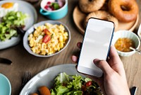 Hand Holding Mobile Phone with Empty Copy Space Screen with Food Background