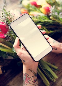 Hand Holding Mobile Phone Showing Blank Design Space Screen