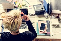 Woman Hands Holding Coffee Cup Working on Laptop