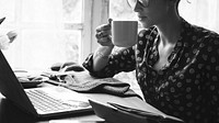 Woman Hands Holding Coffee Cup Working on Laptop