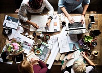 Flatlay of colleagues working at a desk