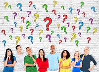 Group Of Multi-Ethnic Casual People Looking Up At The Question Marks