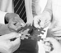 Group business people connecting jigsaw together