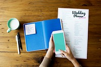 Wedding Planner Checklist Paper on Wooden Table