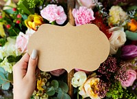 People Hand Holding Blank Design Space Card with Flowers Bouquet Background