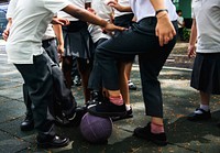 Boys playing ball at school