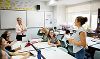 Group of students learning in classroom