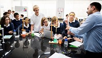 A group of student listening about a science experiment 