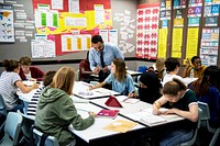 Group of students learning with their teacher