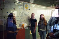 Students giving a presentation in a classroom 