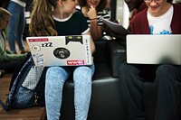 Group of students using laptop for research