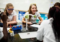 Group of school girls learning science class