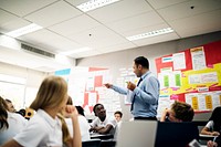 Students learning in a classroom with a teacher