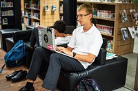 High school student using computer laptop