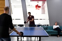 People break playing table tennis relax