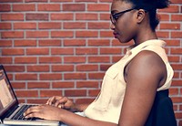 African descent woman using computer laptop