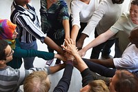 Diversity teamwork with joined hands