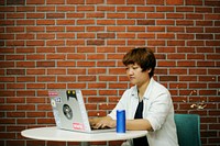 Woman working on laptop networking technology