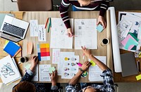 Colleagues working together at a desk 