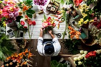 Florist making a flower arrangement in a flower shop