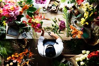 Florist making a flower arrangement at a flower shop