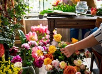 Florist making a flower arrangement in a flower shop