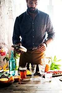 Bartender mixing colorful cocktails