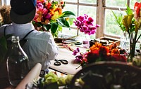 Florist working on the workspace in flower shop