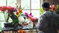 Florist working on the workspace in flower shop